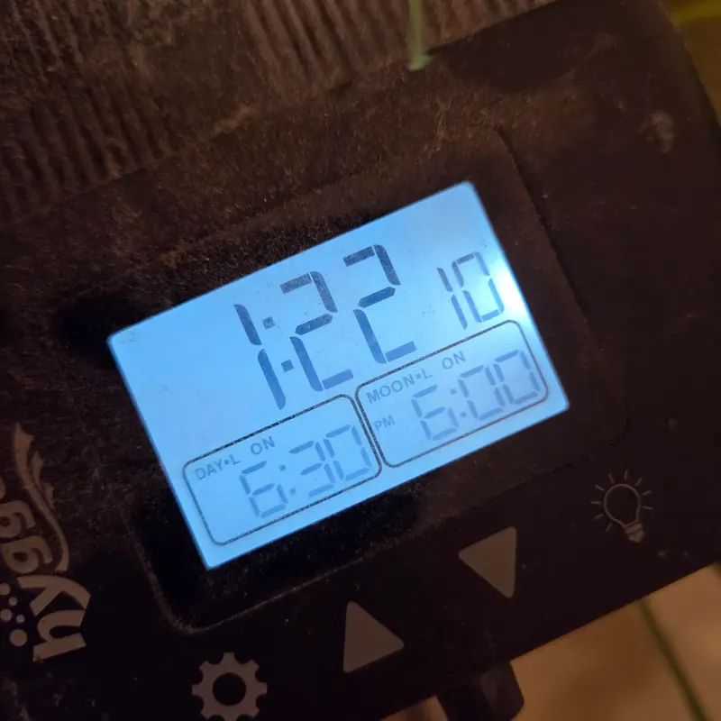 Hygger LED display showing the clock and the on and off times